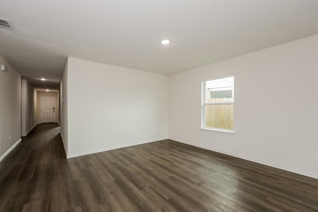 417 Shorty Street Mabank, TX 75147 - Photo 3 of 20 wooden floor in an empty room with a window