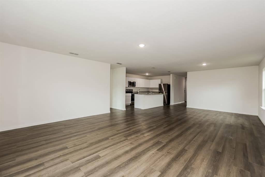 417 Shorty Street Mabank, TX 75147 - Photo 5 of 20 a view of empty room with wooden floor