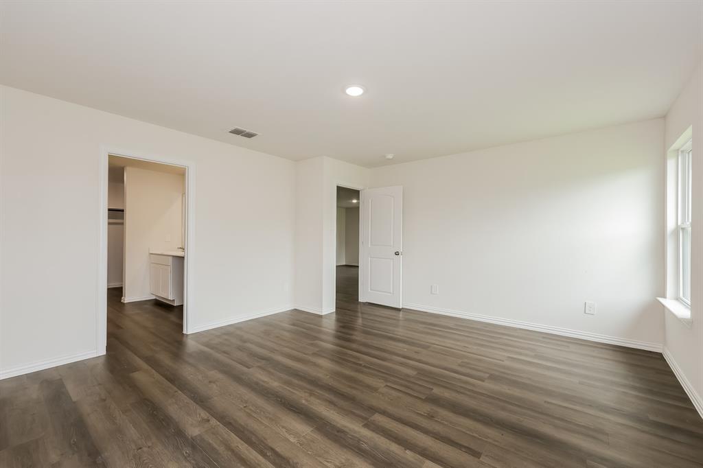 417 Shorty Street Mabank, TX 75147 - Photo 10 of 20 a view of an empty room with wooden floor