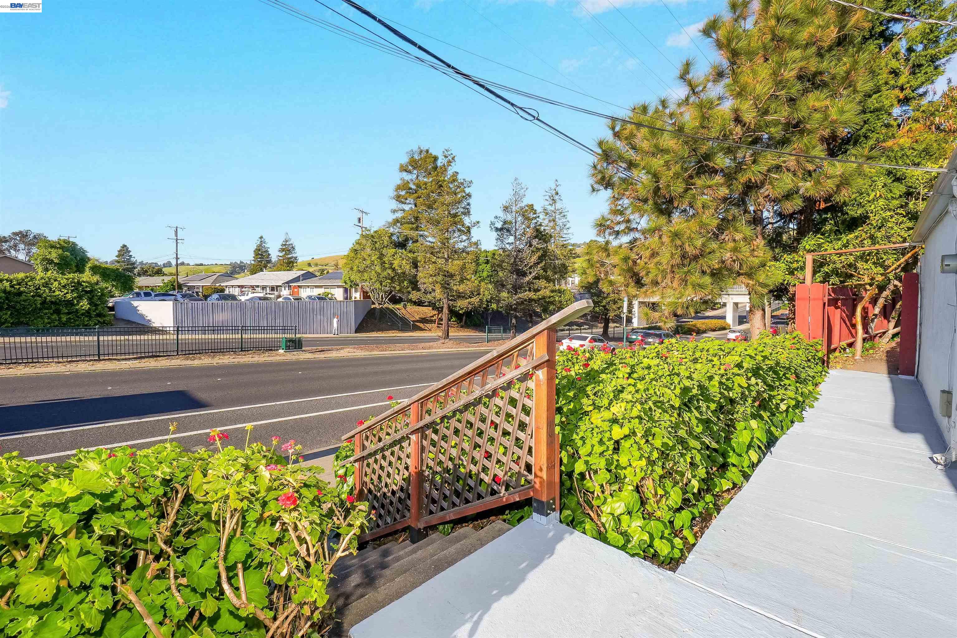 387 Tennyson Road Hayward, CA 94544 - Photo 12 of 48 a view of a street with a bench in front of it