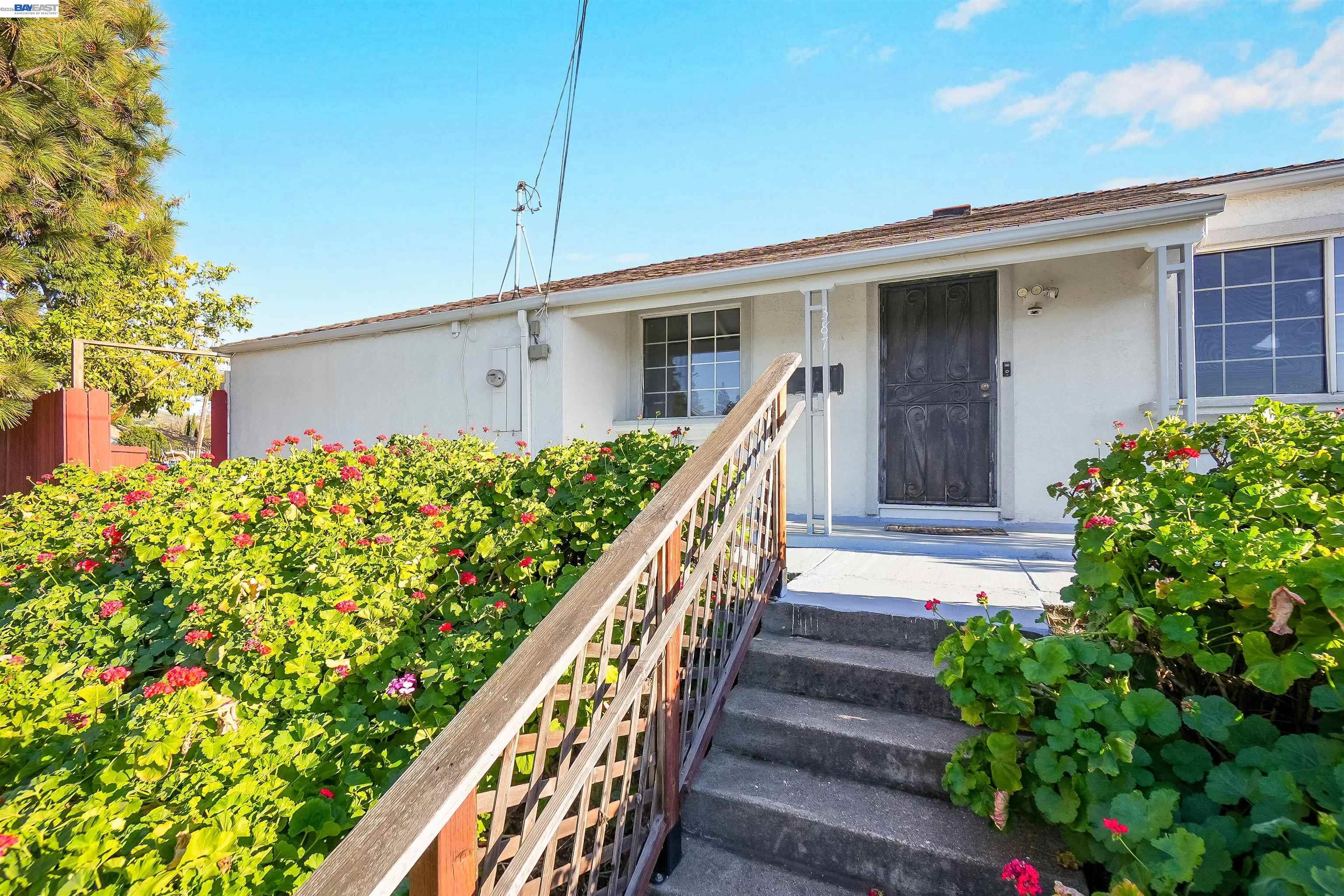 387 Tennyson Road Hayward, CA 94544 - Photo 2 of 48 a view of a house with wooden fence