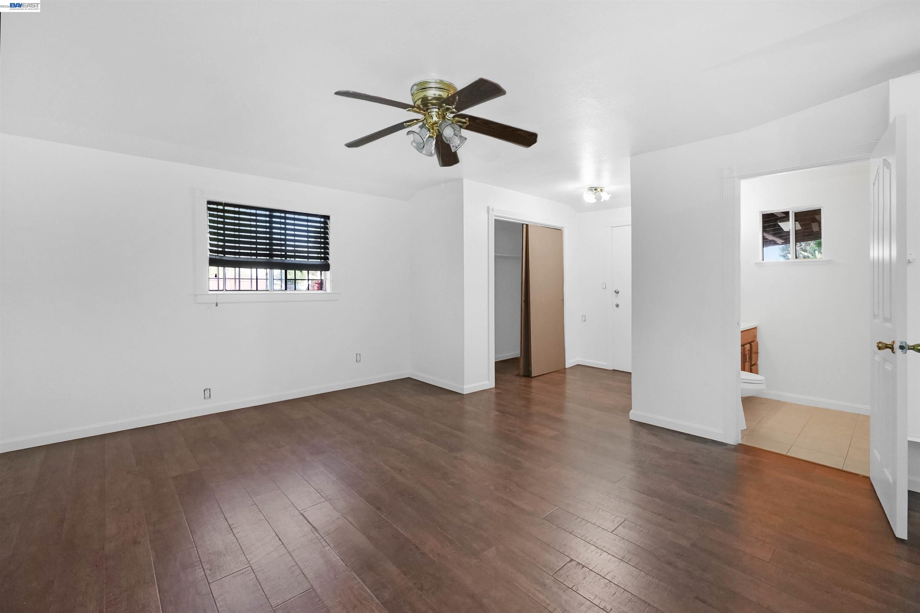 387 Tennyson Road Hayward, CA 94544 - Photo 29 of 48 a view of empty room with wooden floor and ceiling fan