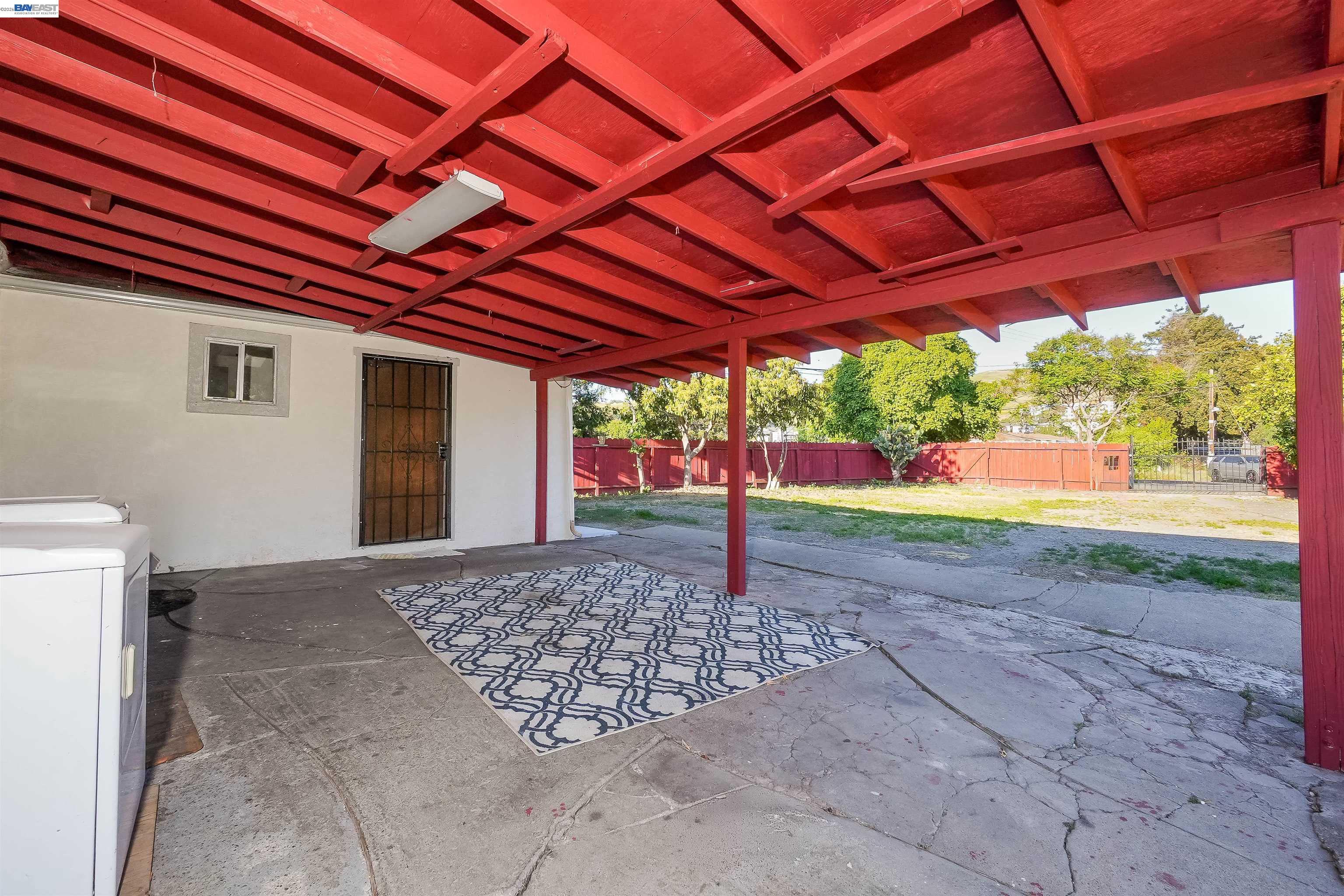 387 Tennyson Road Hayward, CA 94544 - Photo 34 of 48 a view of a backyard with wooden fence