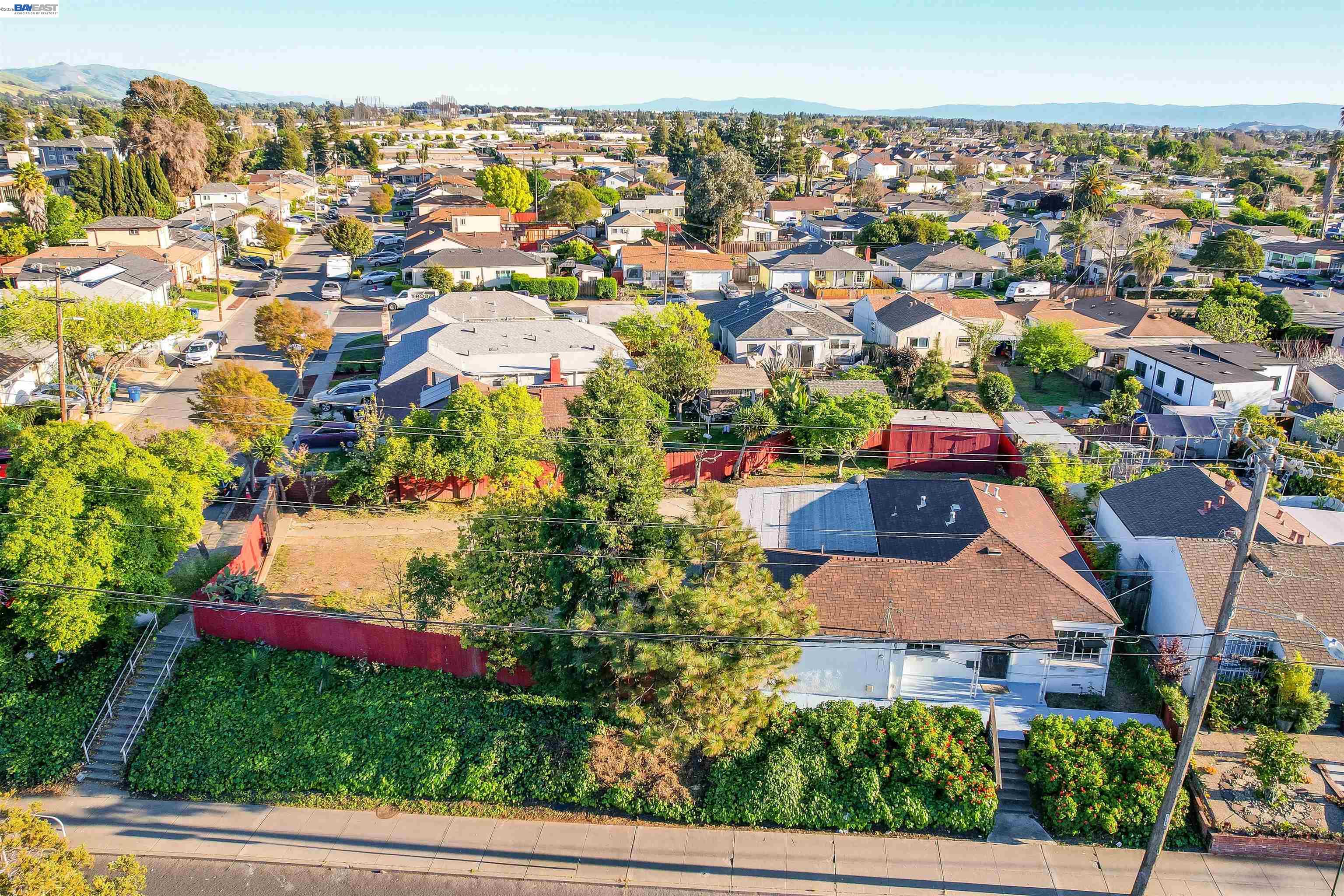 387 Tennyson Road Hayward, CA 94544 - Photo 4 of 48 an aerial view of residential houses with outdoor space and swimming pool