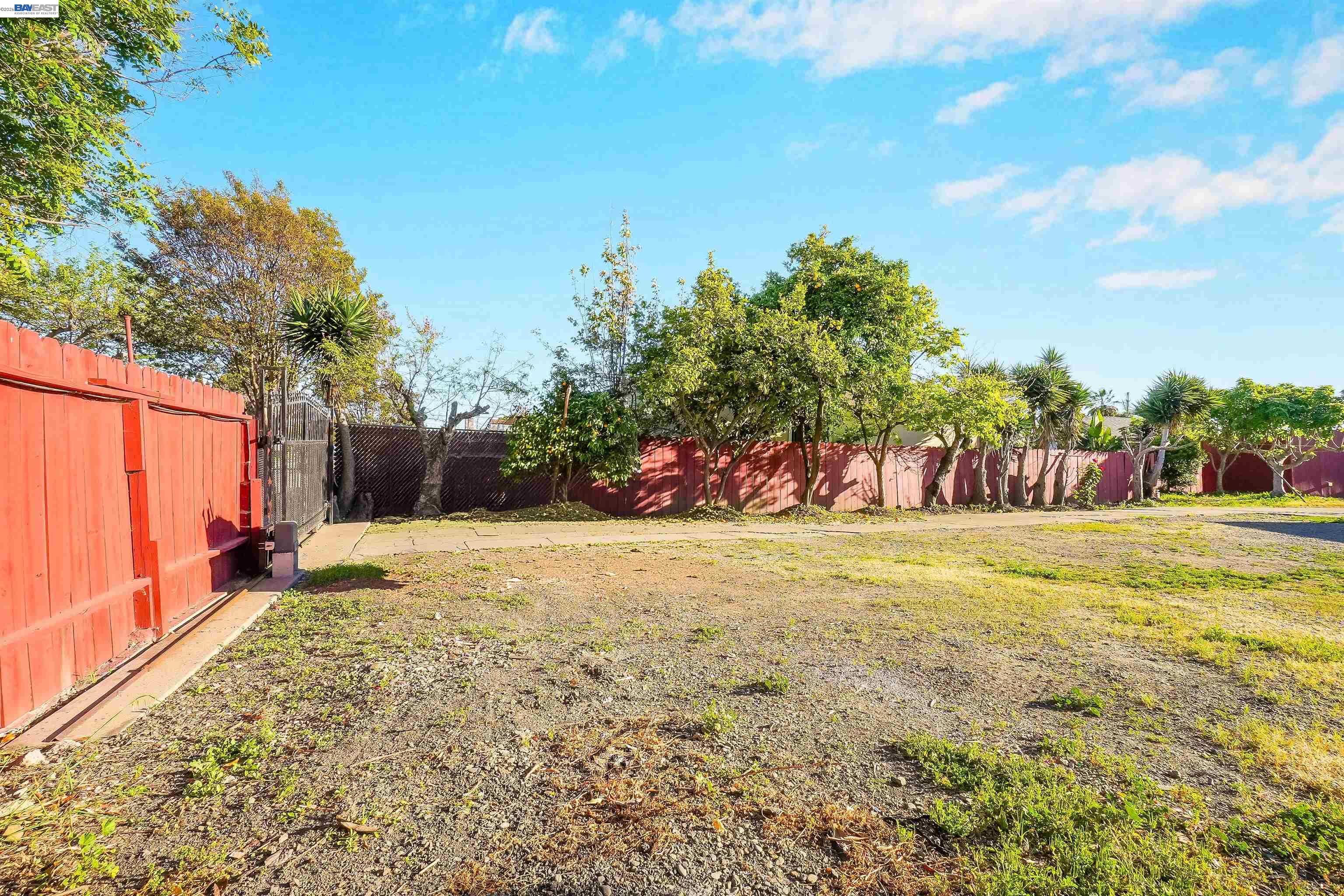 387 Tennyson Road Hayward, CA 94544 - Photo 42 of 48 a view of a yard with an trees