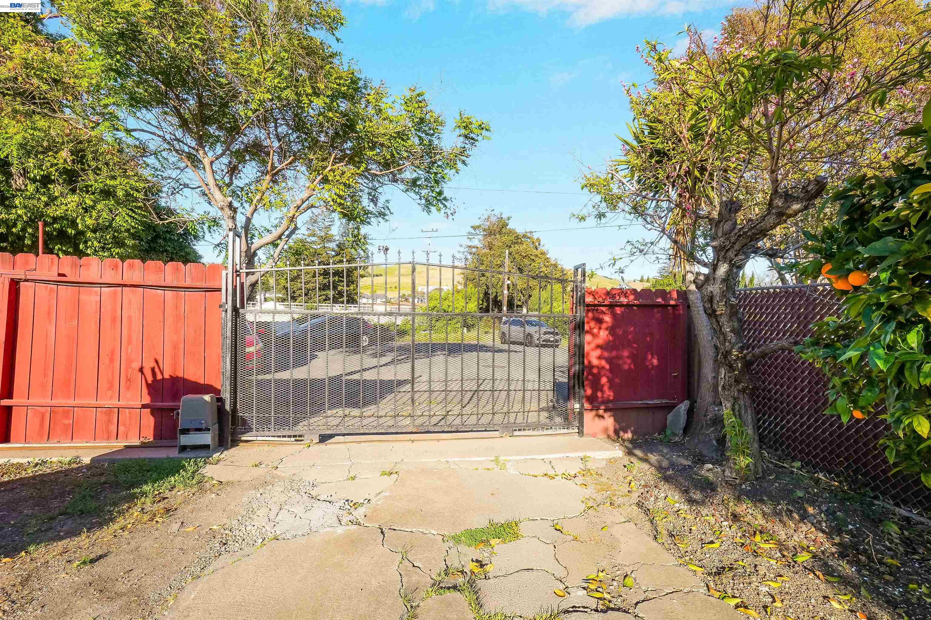 387 Tennyson Road Hayward, CA 94544 - Photo 43 of 48 a front view of a house with a yard