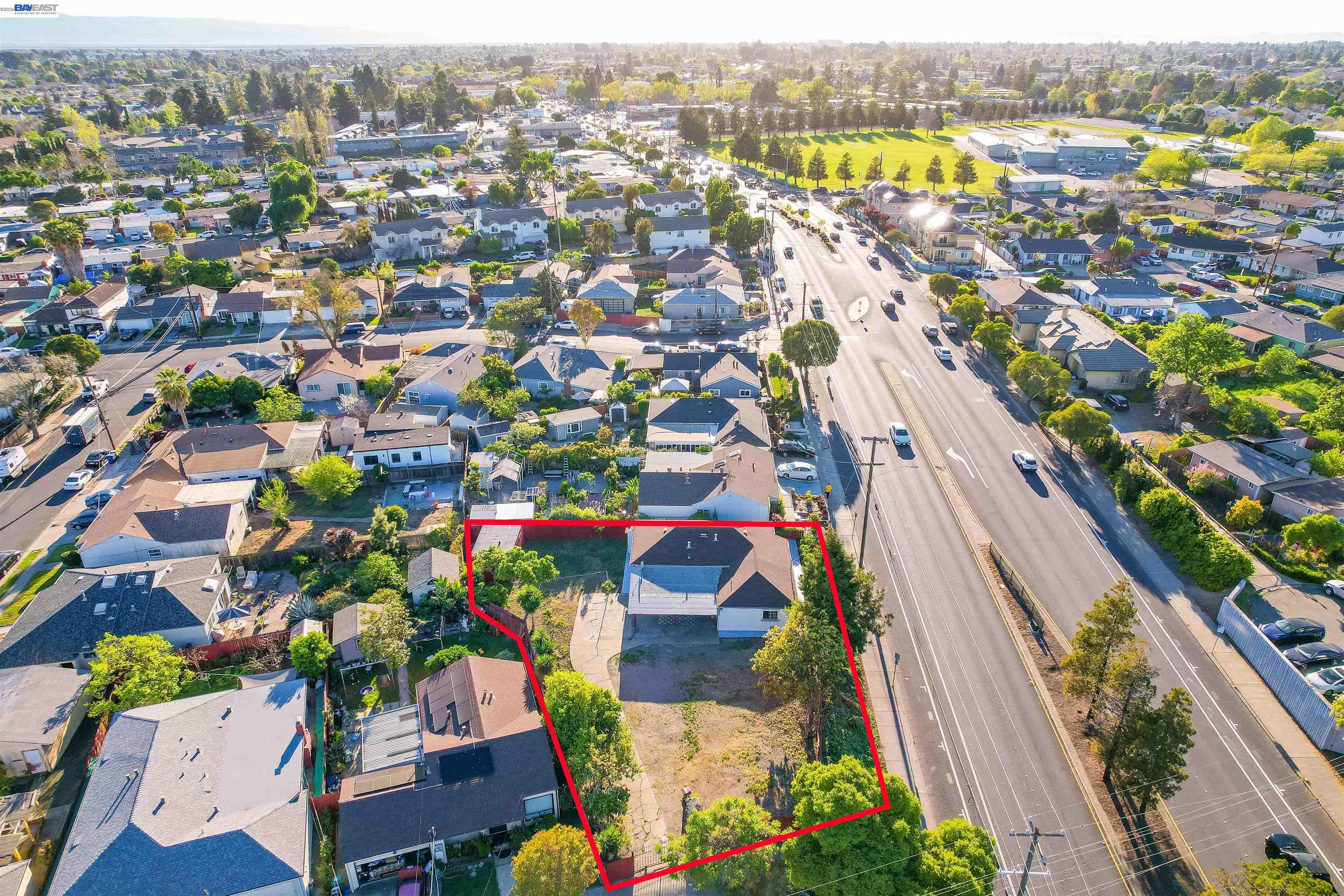 387 Tennyson Road Hayward, CA 94544 - Photo 46 of 48 an aerial view of residential houses with outdoor space and swimming pool