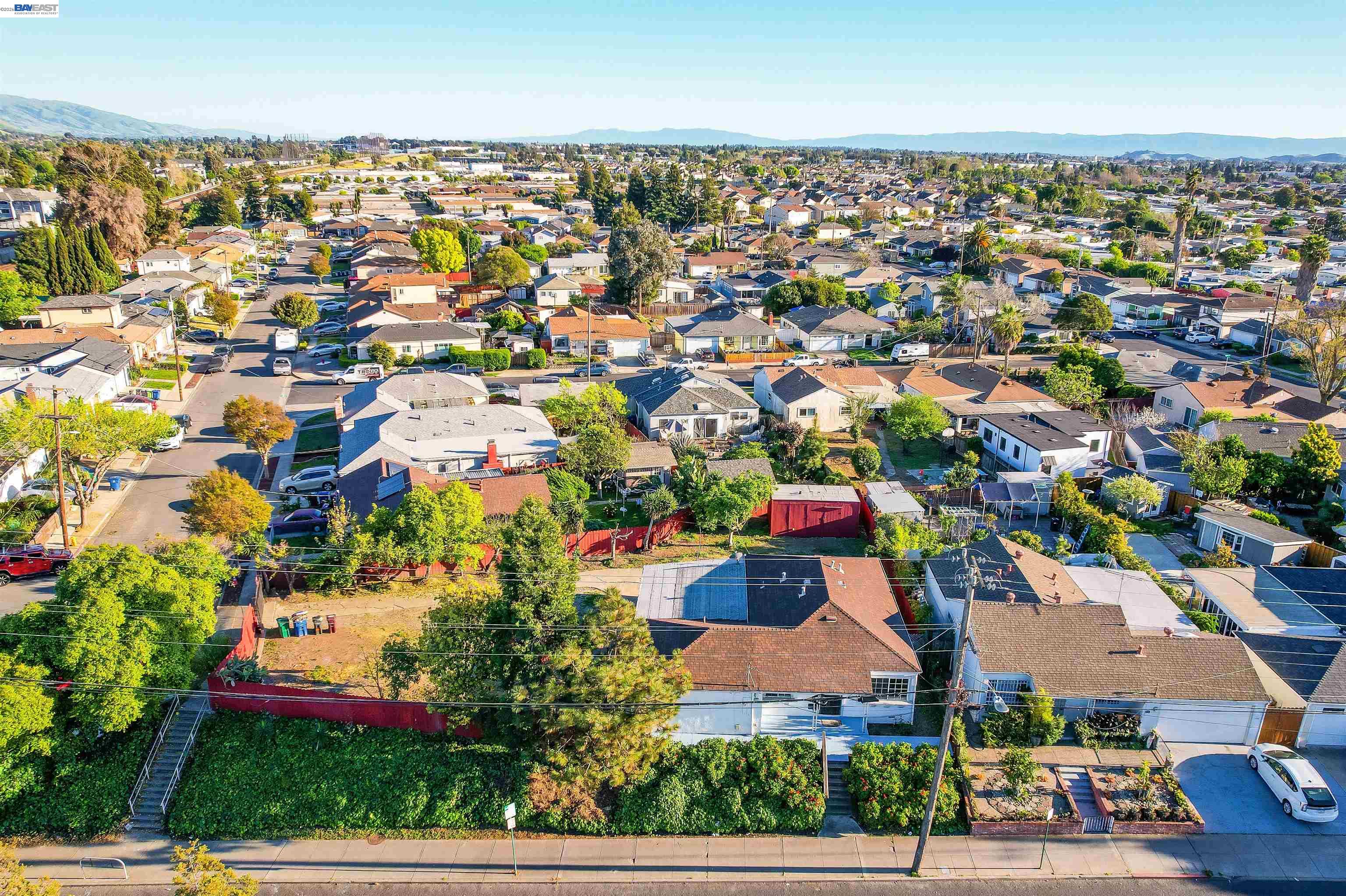 387 Tennyson Road Hayward, CA 94544 - Photo 47 of 48 an aerial view of residential houses with outdoor space and parking