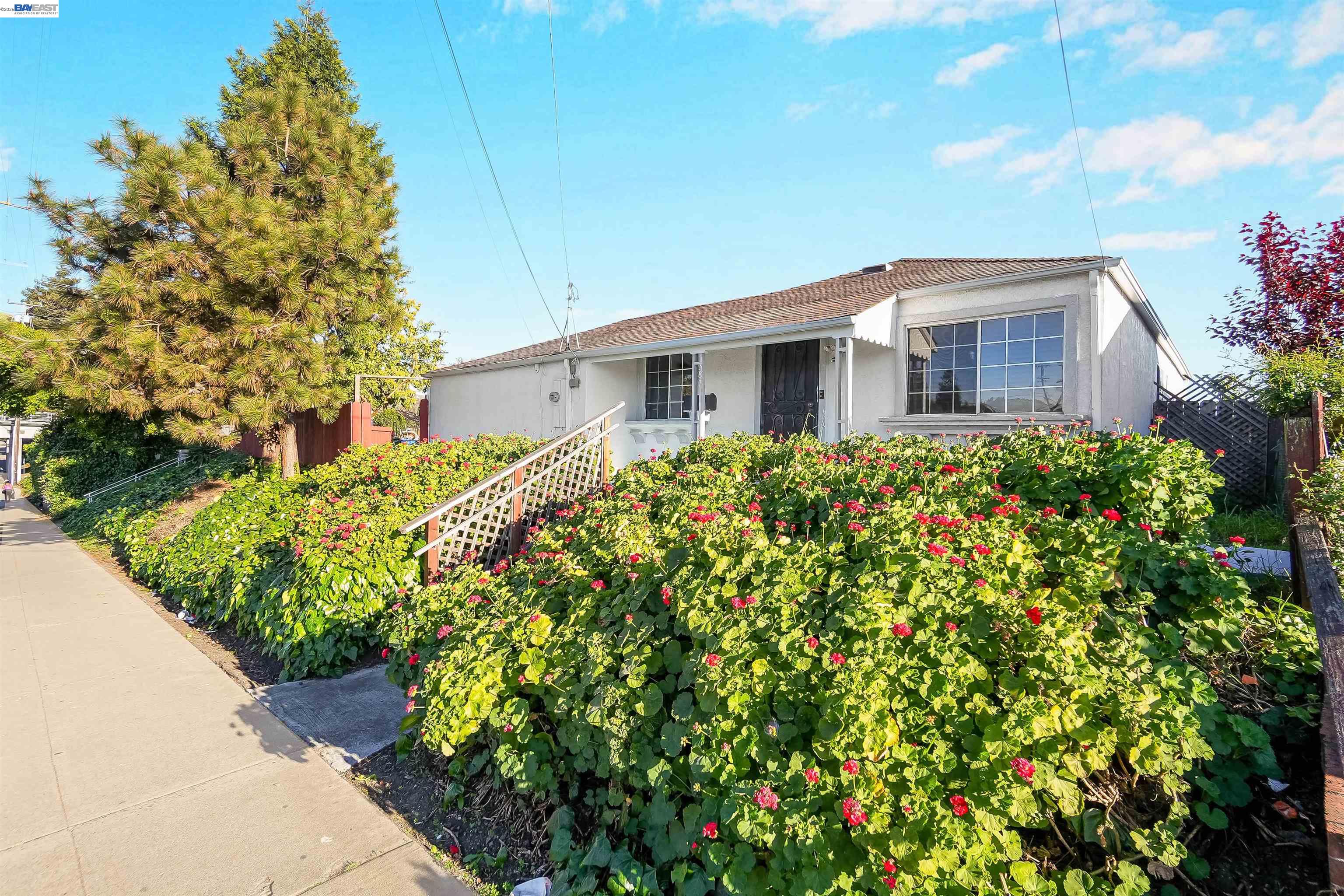 387 Tennyson Road Hayward, CA 94544 - Photo 6 of 48 a house view with a garden space