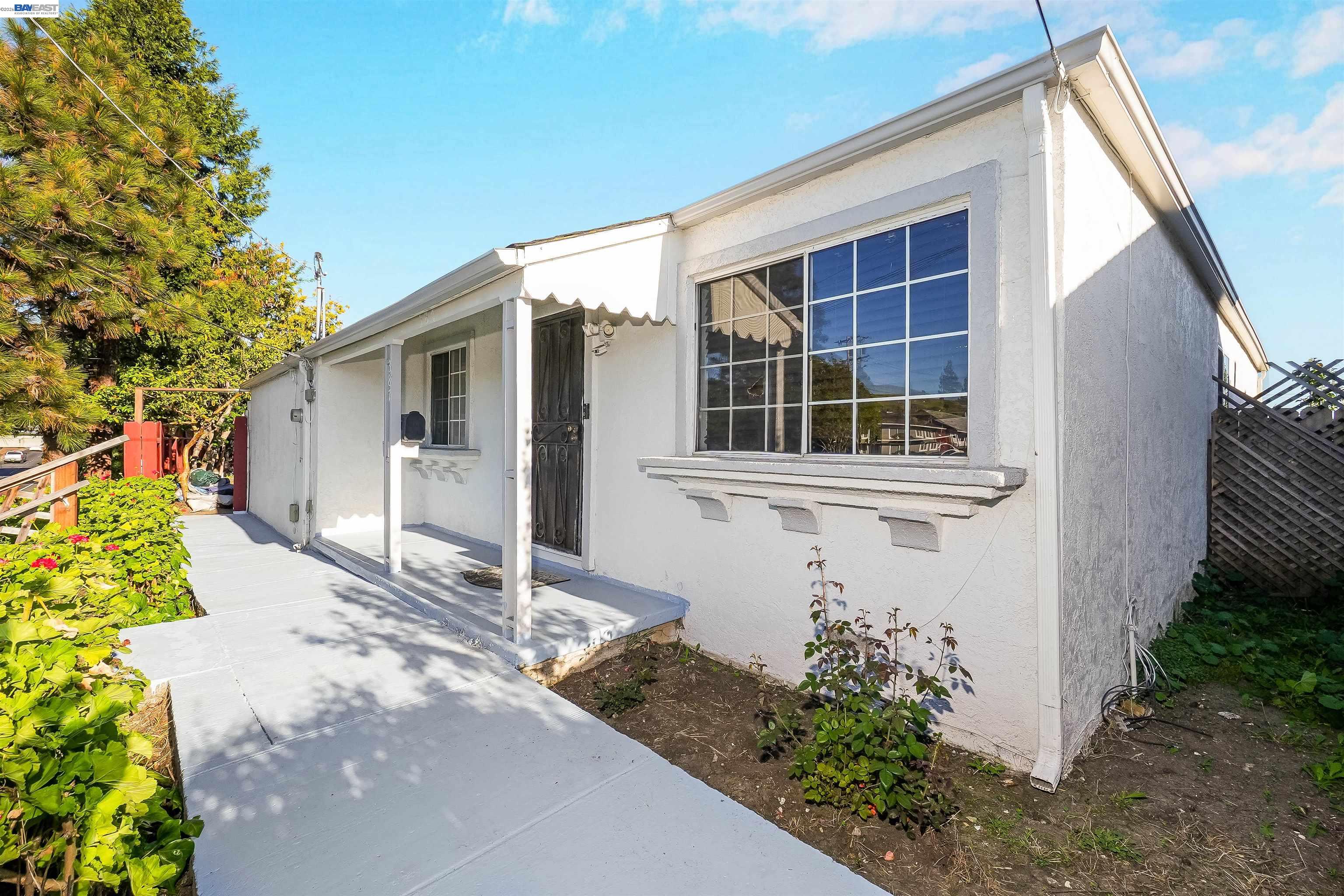 387 Tennyson Road Hayward, CA 94544 - Photo 10 of 48 a house with trees in front of it