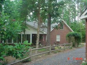 175 River Road Stanfield, NC 28163 - Photo 2 of 8 a view of house with backyard and a garden