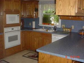 175 River Road Stanfield, NC 28163 - Photo 4 of 8 a kitchen with sink cabinets and outdoor view