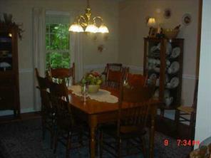 175 River Road Stanfield, NC 28163 - Photo 5 of 8 a view of a dining room with furniture and chandelier