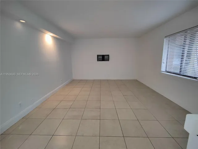 a view of an empty room and window