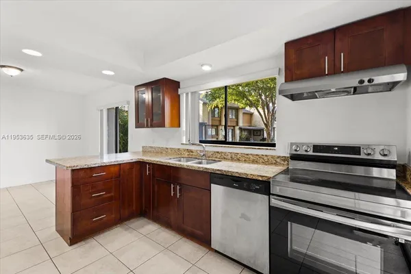 a kitchen with a cabinets and stove