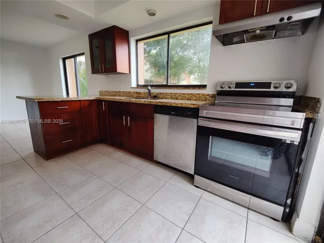 a kitchen with a stove and a microwave