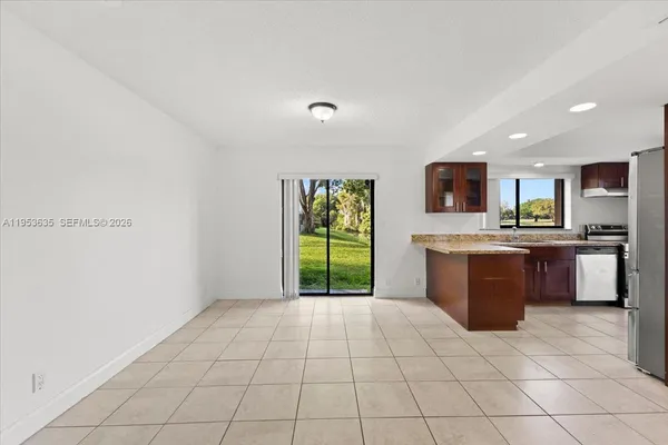 a view of a kitchen with a sink and a microwave