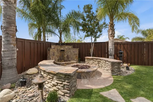 a view of a backyard with sitting area