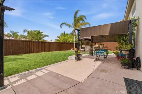 a front view of a house with outdoor seating