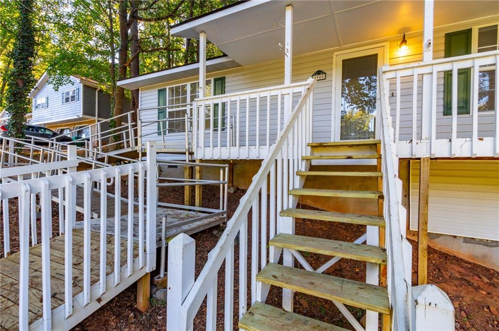 4908 Tarleton Drive Southwest Lilburn, GA 30047 - Photo 34 of 41 a view of a house with wooden fence