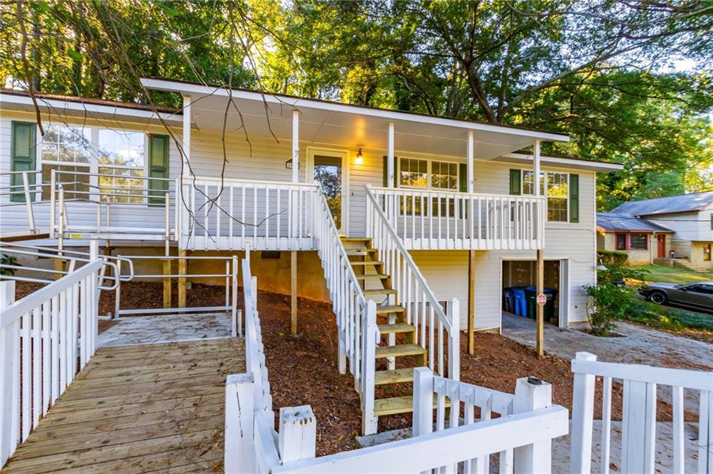 4908 Tarleton Drive Southwest Lilburn, GA 30047 - Photo 36 of 41 a view of a house with a balcony