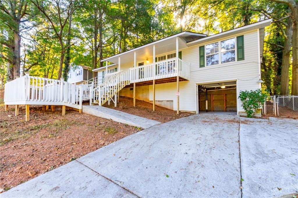 4908 Tarleton Drive Southwest Lilburn, GA 30047 - Photo 37 of 41 a view of a house with a yard