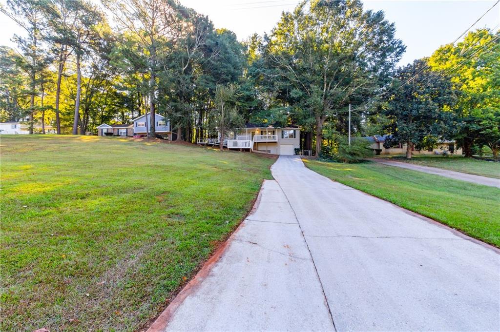 4908 Tarleton Drive Southwest Lilburn, GA 30047 - Photo 40 of 41 a view of a park with large trees