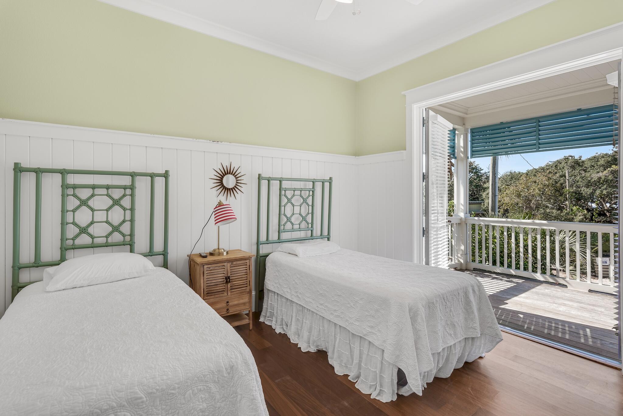 433 Defuniak Street Santa Rosa Beach, FL 32459 - Photo 28 of 57 a bedroom with two beds and a large window