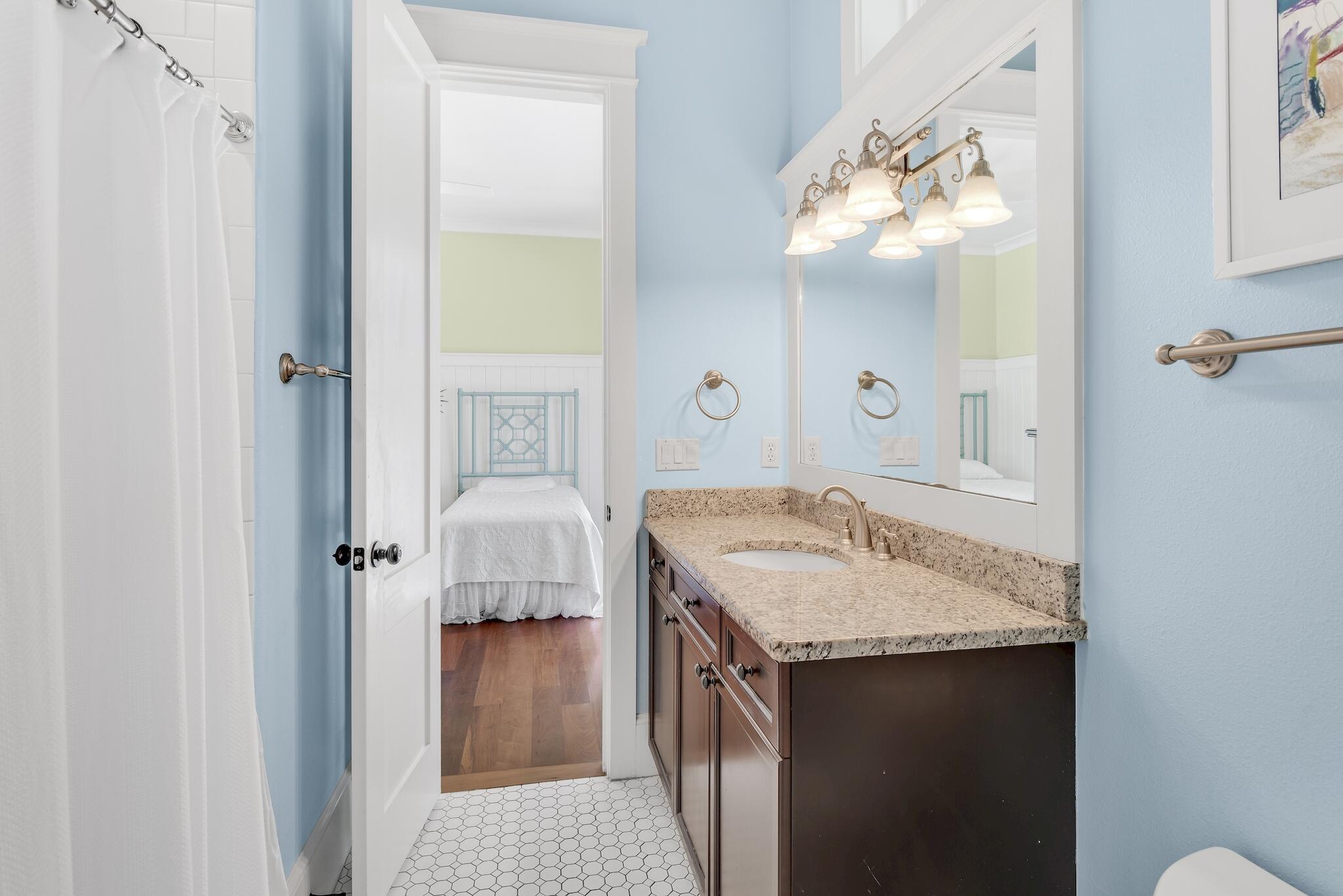 433 Defuniak Street Santa Rosa Beach, FL 32459 - Photo 32 of 57 a en suite bathroom with a granite countertop sink and a mirror
