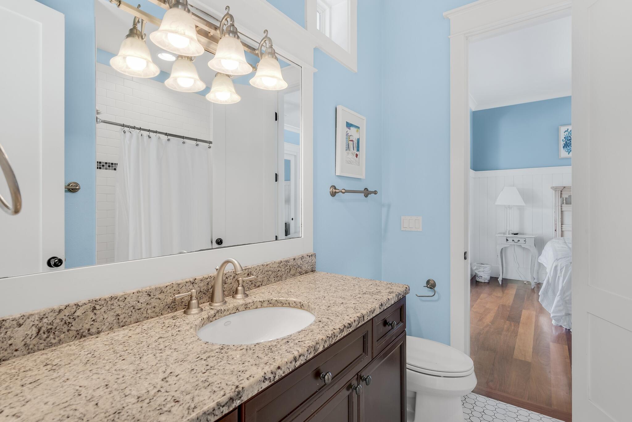 433 Defuniak Street Santa Rosa Beach, FL 32459 - Photo 33 of 57 a bathroom with a granite countertop sink and a mirror