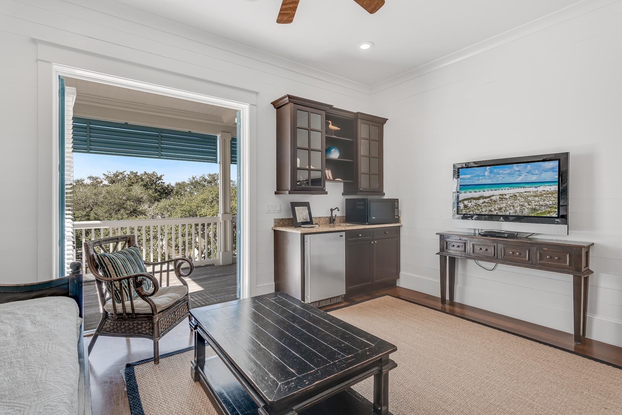 433 Defuniak Street Santa Rosa Beach, FL 32459 - Photo 39 of 57 a living room with furniture a piano and a window