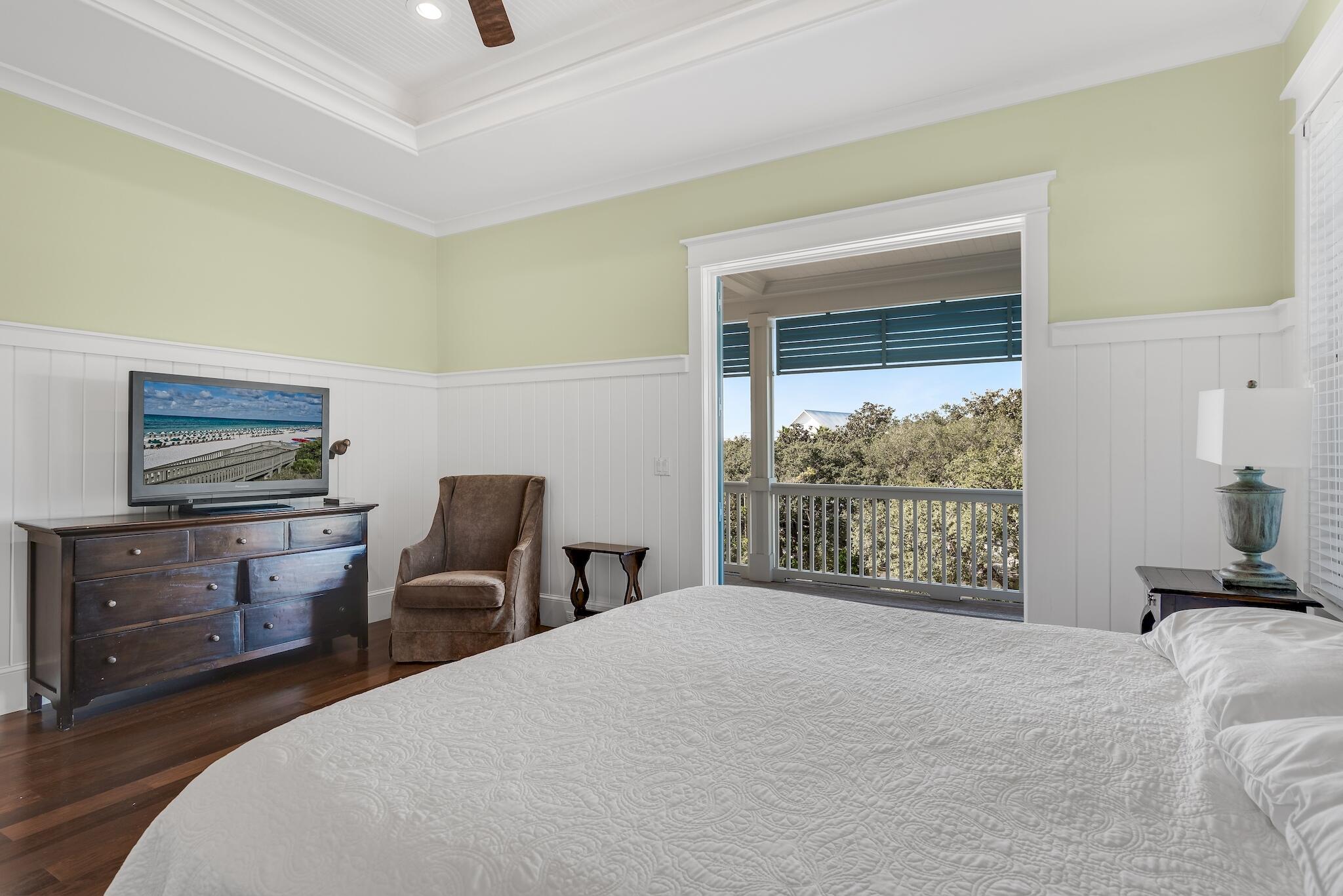 433 Defuniak Street Santa Rosa Beach, FL 32459 - Photo 41 of 57 a bedroom with a bed and a tv