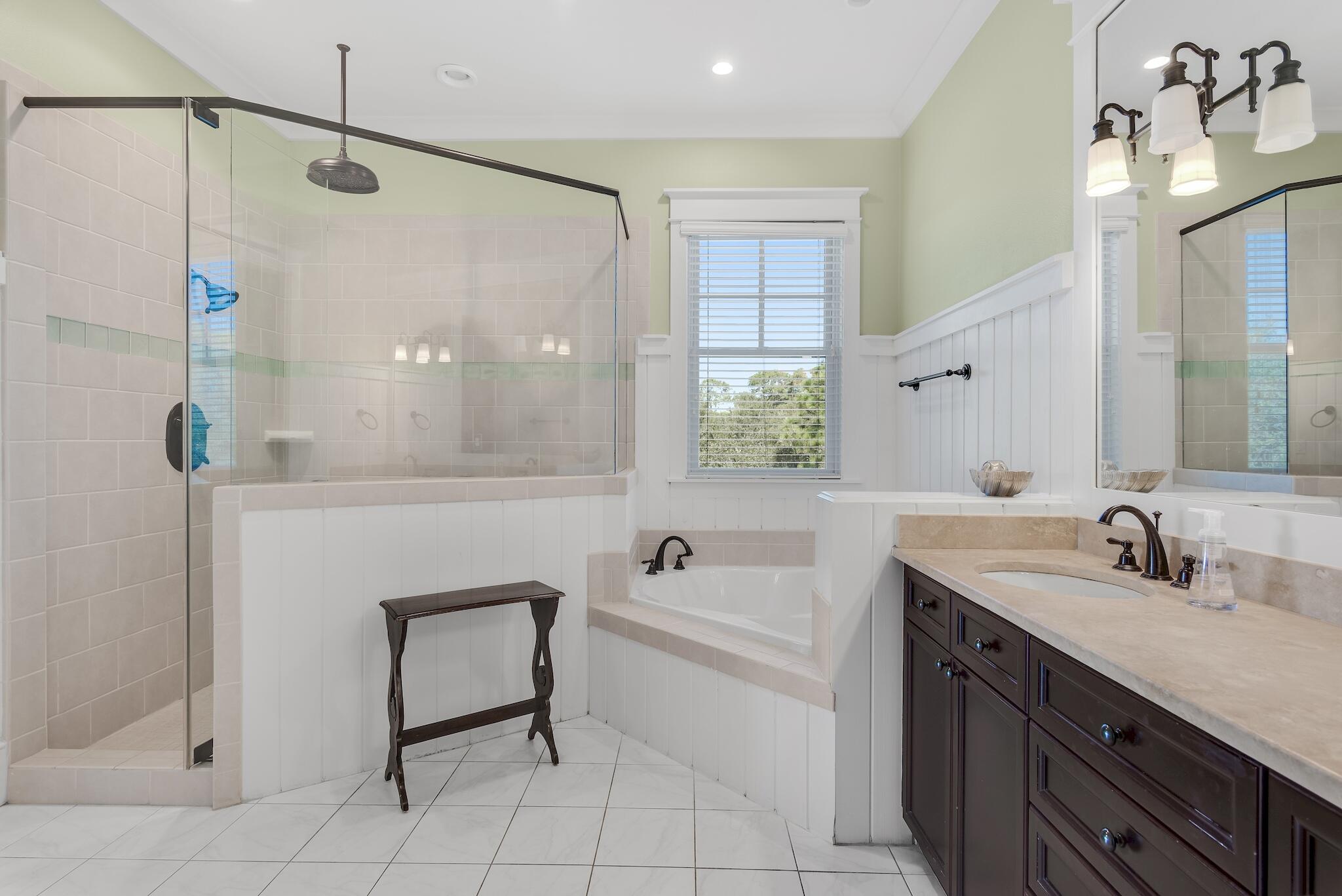 433 Defuniak Street Santa Rosa Beach, FL 32459 - Photo 43 of 57 a bathroom with a tub sink and mirror