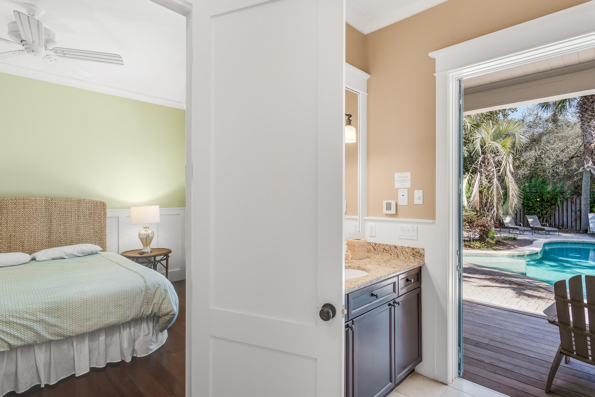 433 Defuniak Street Santa Rosa Beach, FL 32459 - Photo 48 of 57 a bedroom with a bed and a window