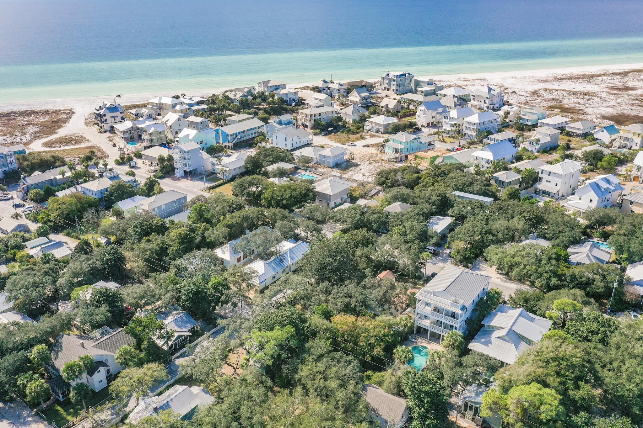 433 Defuniak Street Santa Rosa Beach, FL 32459 - Photo 54 of 57 an aerial view of a city with lots of residential buildings and ocean view in back