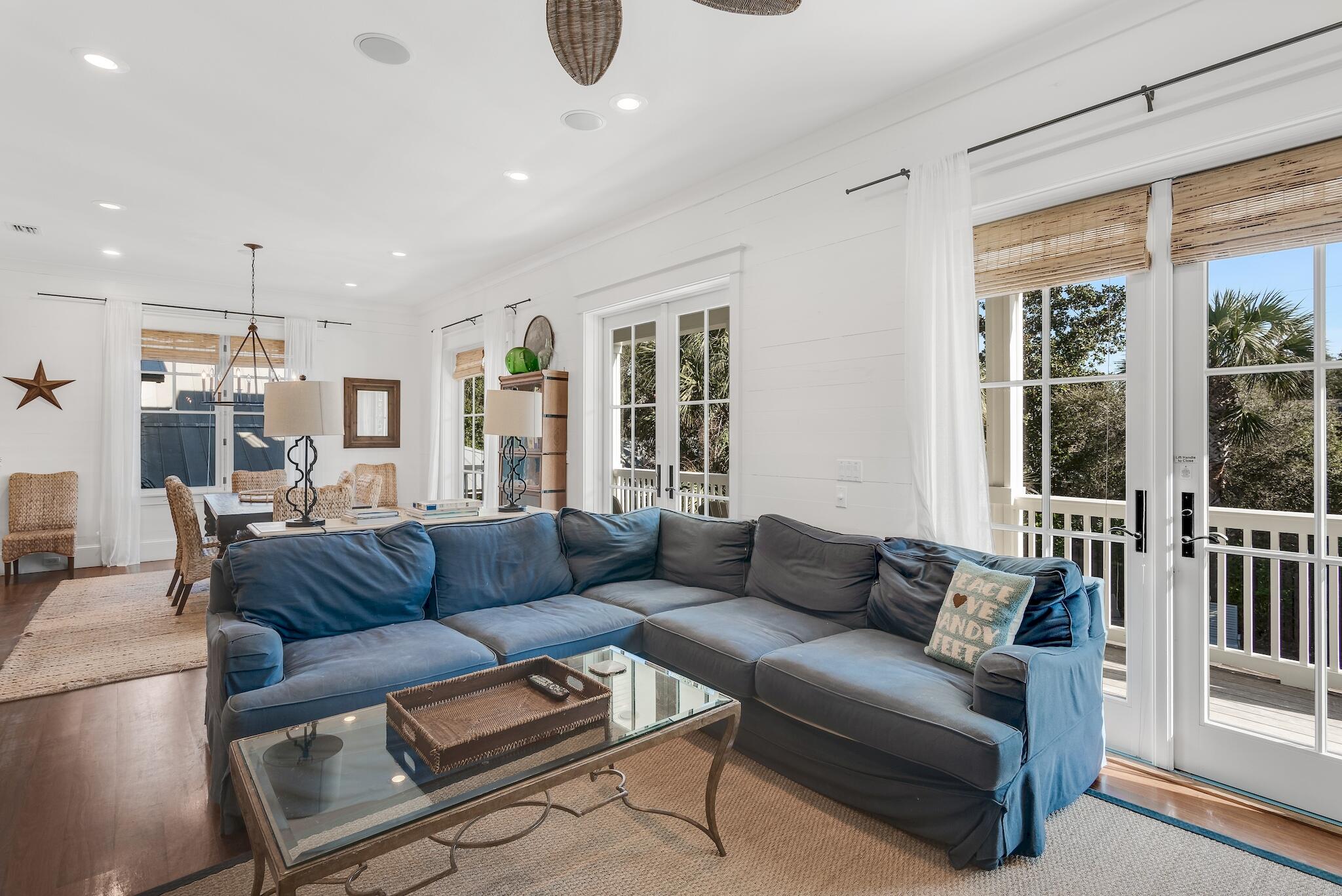 433 Defuniak Street Santa Rosa Beach, FL 32459 - Photo 6 of 57 a living room with furniture and a large window