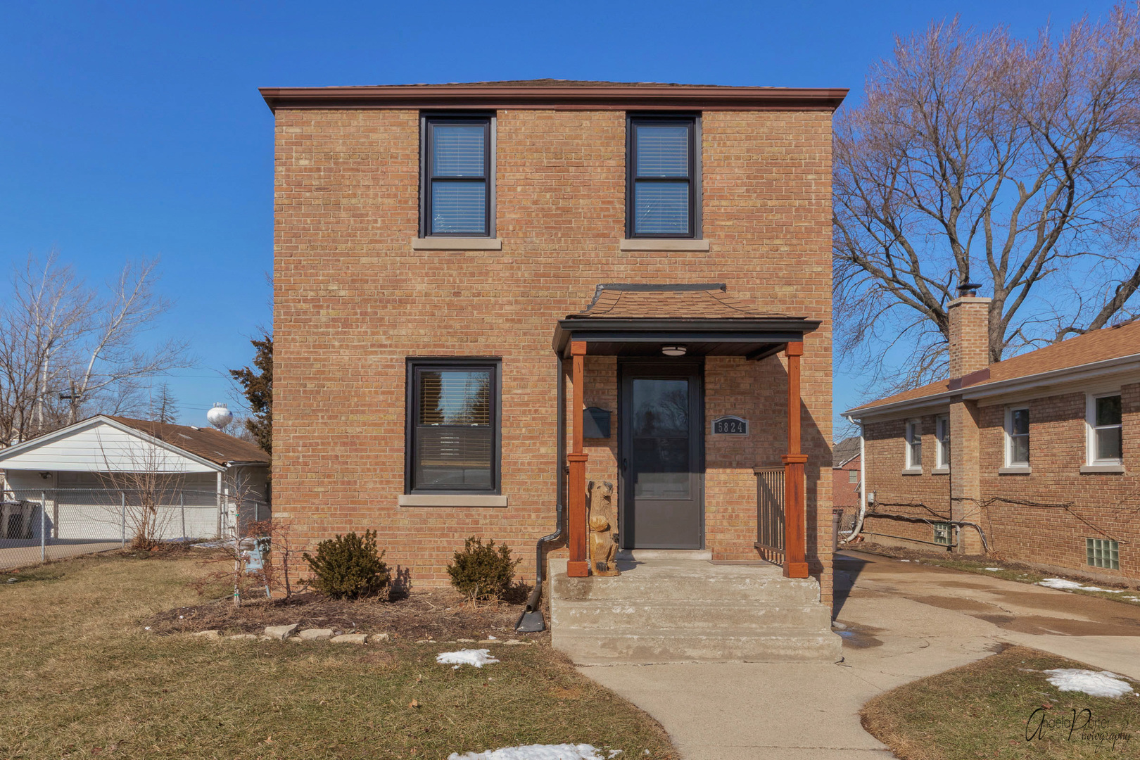 a front view of a house with garage