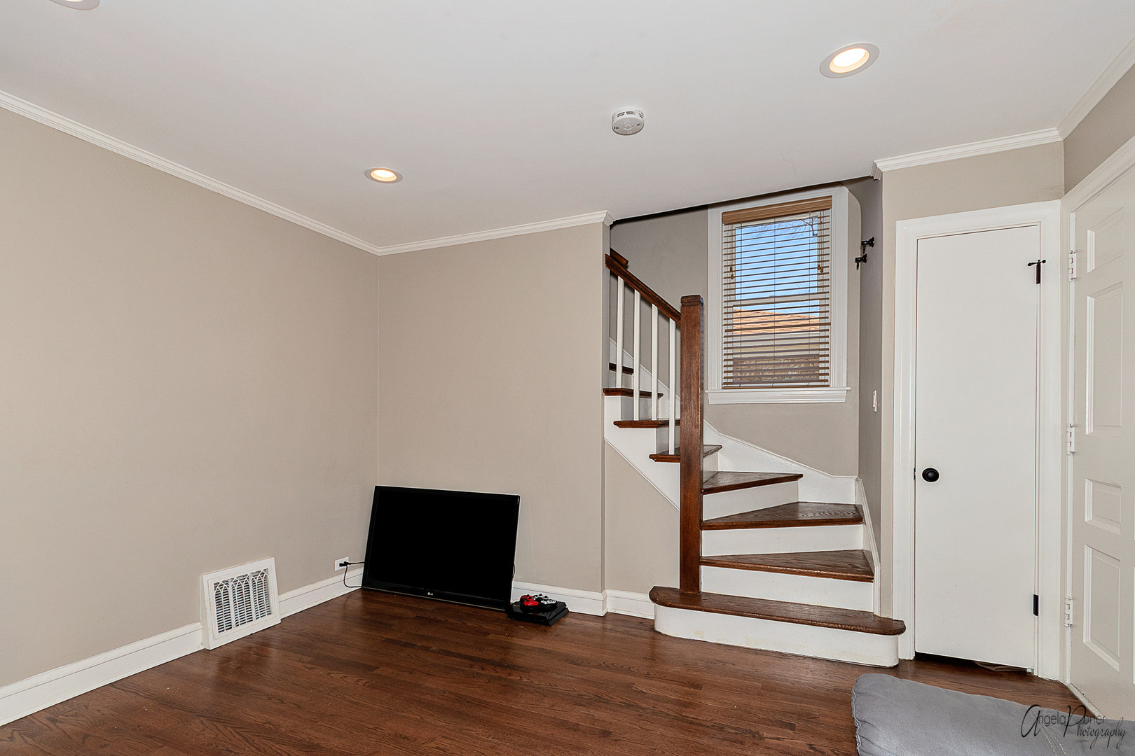 5824 Prospect Avenue Berkeley, IL 60163 - Photo 13 of 26 a view of an empty room with wooden floor and stairs
