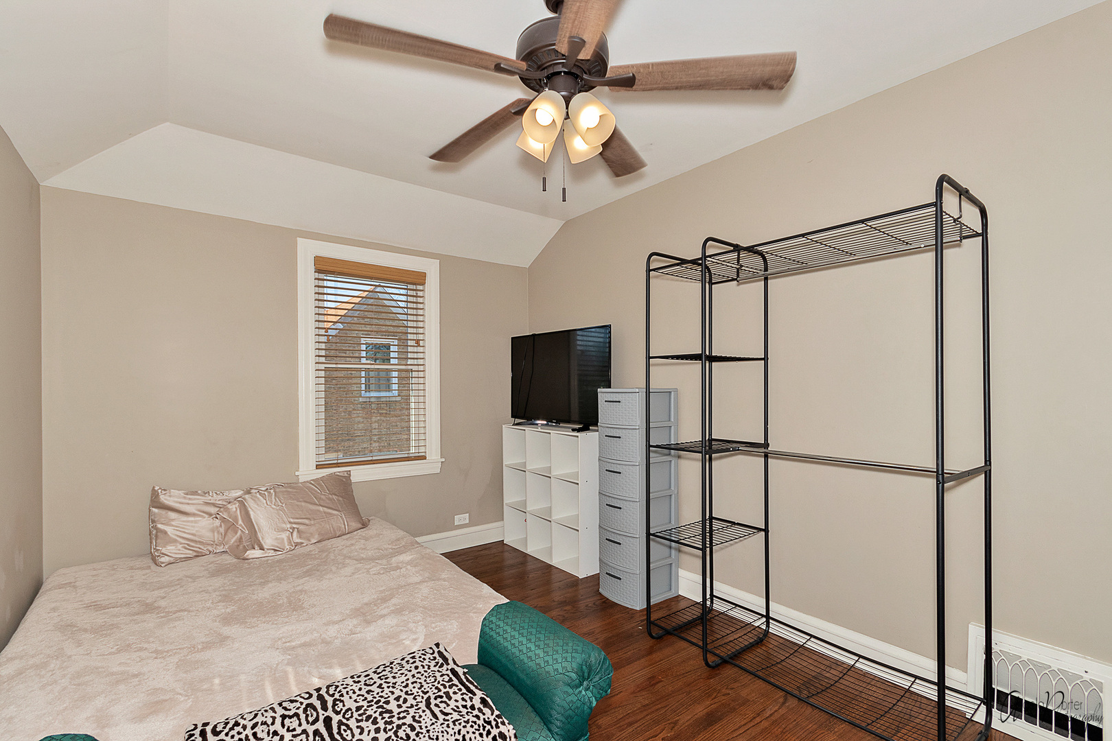 5824 Prospect Avenue Berkeley, IL 60163 - Photo 17 of 26 a bedroom with a bed and a flat screen tv