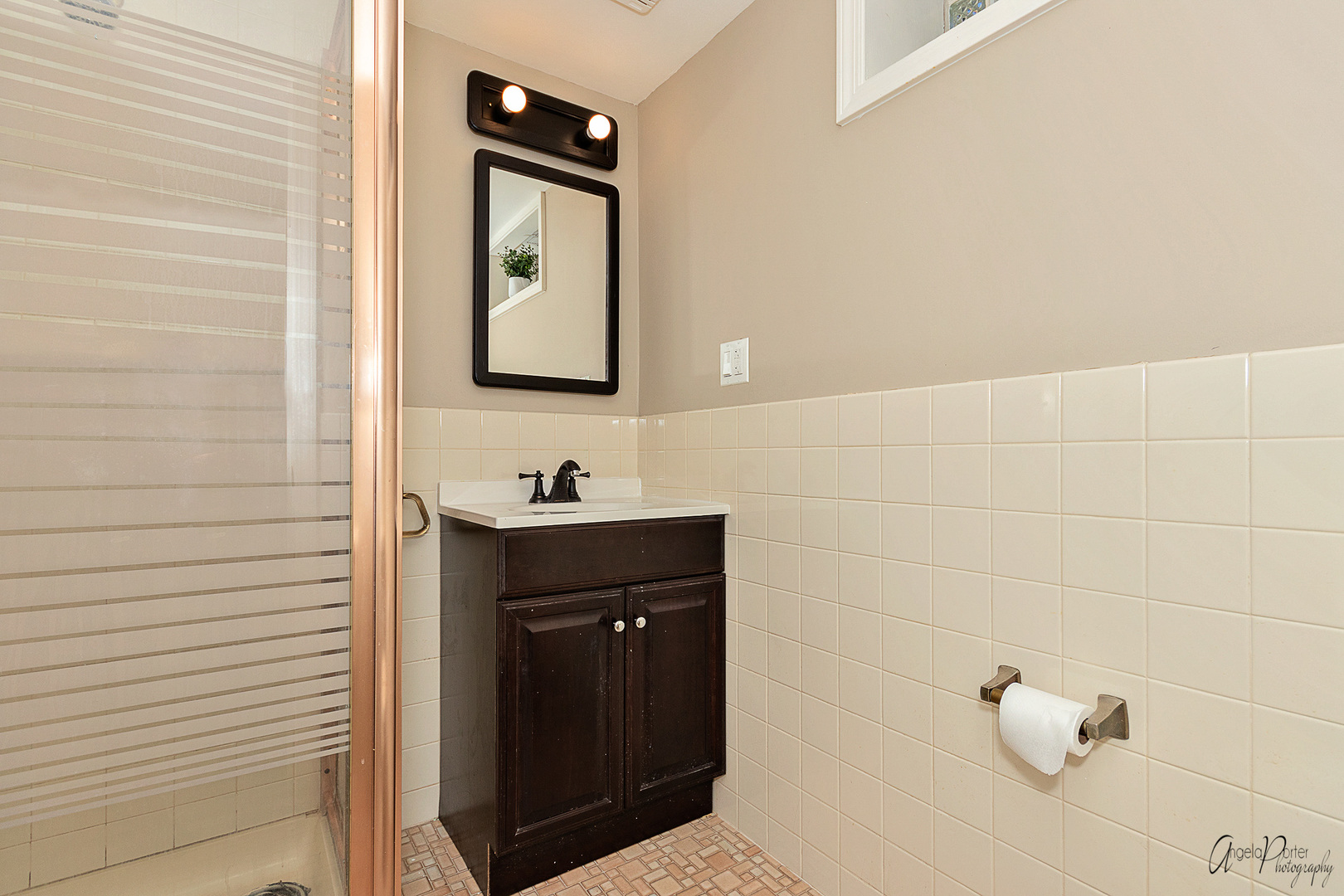 5824 Prospect Avenue Berkeley, IL 60163 - Photo 22 of 26 a bathroom with a sink and a mirror