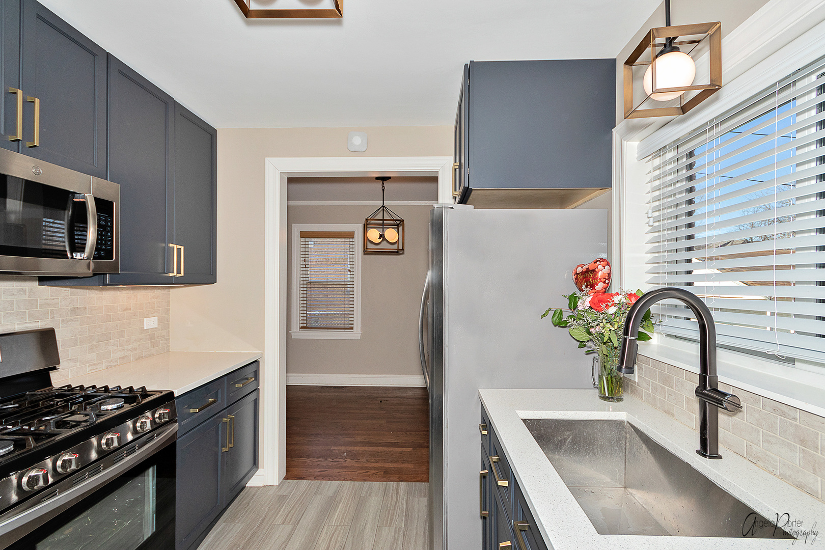 5824 Prospect Avenue Berkeley, IL 60163 - Photo 4 of 26 a kitchen with granite countertop a sink stainless steel appliances and cabinets