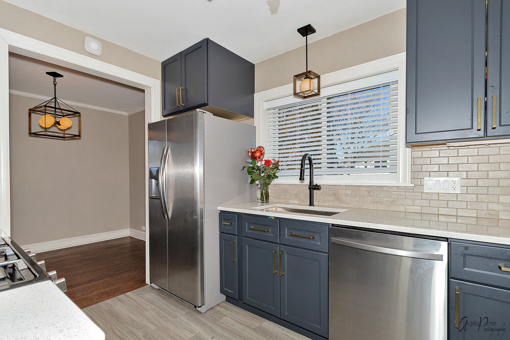 5824 Prospect Avenue Berkeley, IL 60163 - Photo 5 of 26 a kitchen with stainless steel appliances granite countertop a refrigerator and a sink