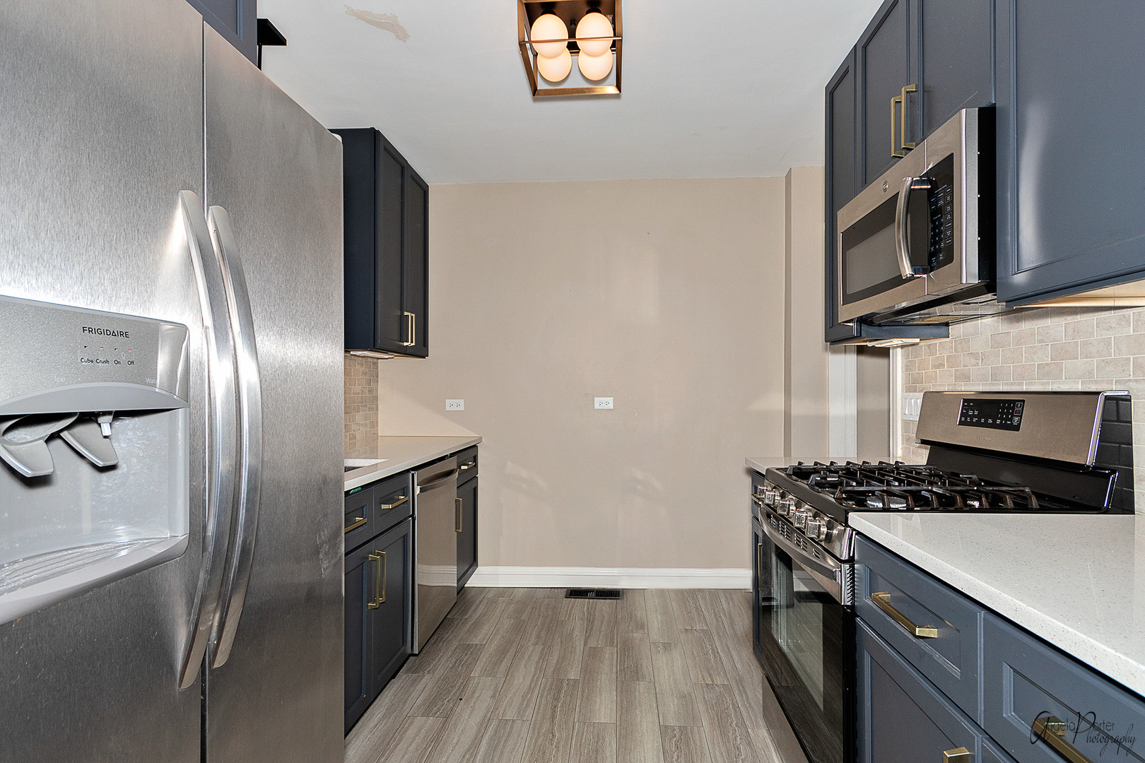 5824 Prospect Avenue Berkeley, IL 60163 - Photo 6 of 26 a kitchen with stainless steel appliances granite countertop a stove a sink and a refrigerator