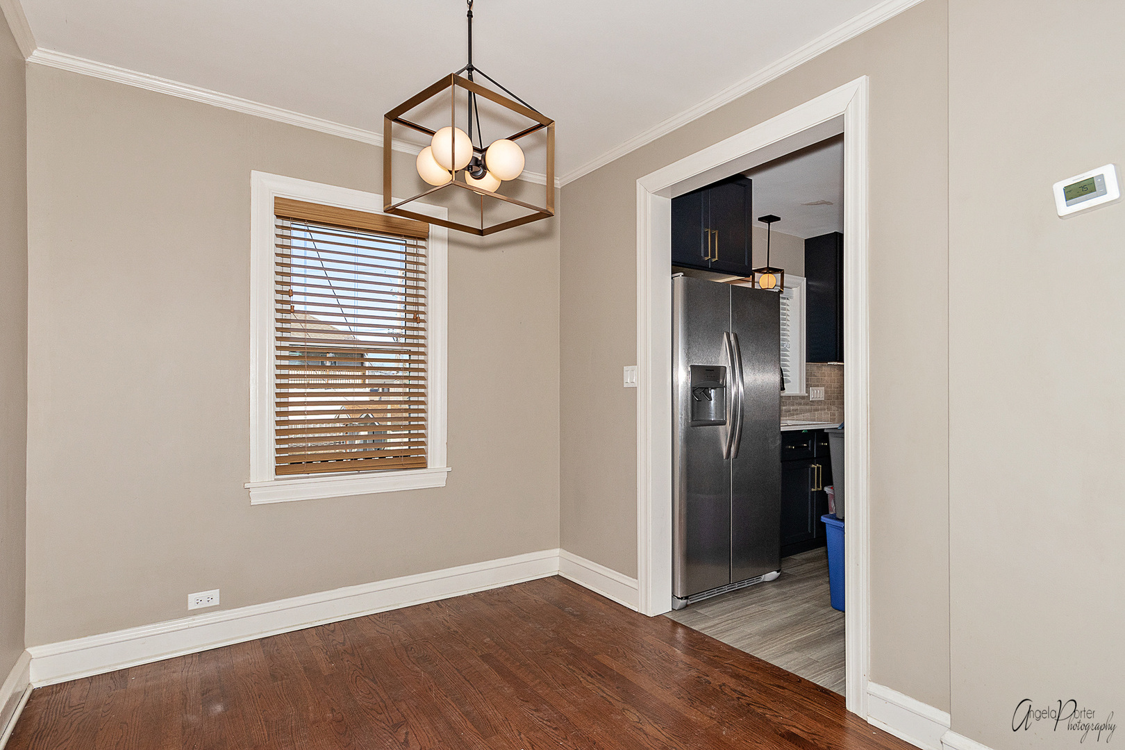 5824 Prospect Avenue Berkeley, IL 60163 - Photo 7 of 26 an empty room with wooden floor closet and windows