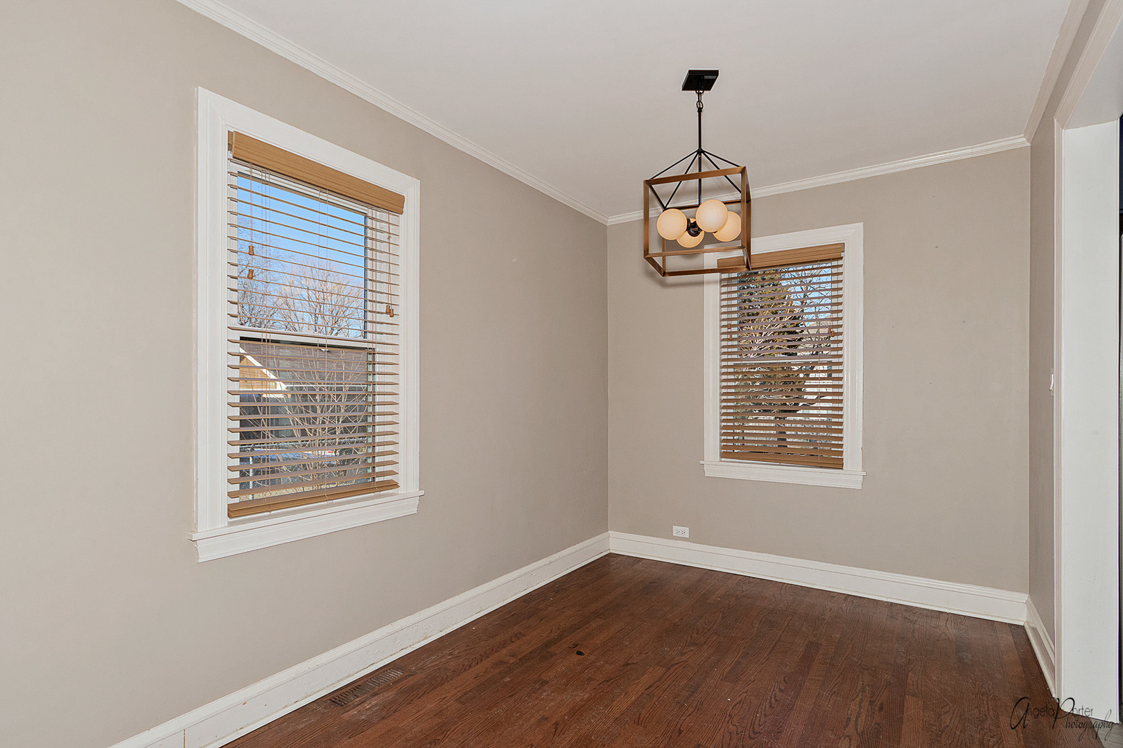 5824 Prospect Avenue Berkeley, IL 60163 - Photo 8 of 26 a view of an empty room with wooden floor and a window