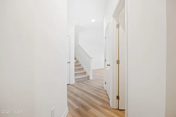 a view of a hallway with staircase
