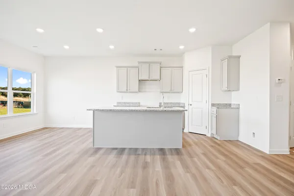 a view of kitchen with wooden floor