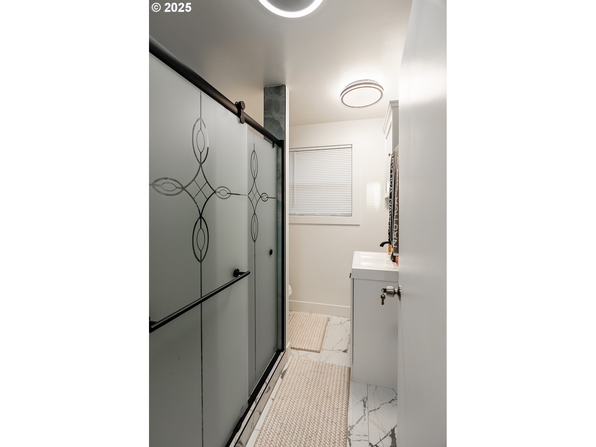 815 North King Street Seaside, OR 97138 - Photo 12 of 33 a bathroom with a shower and a sink