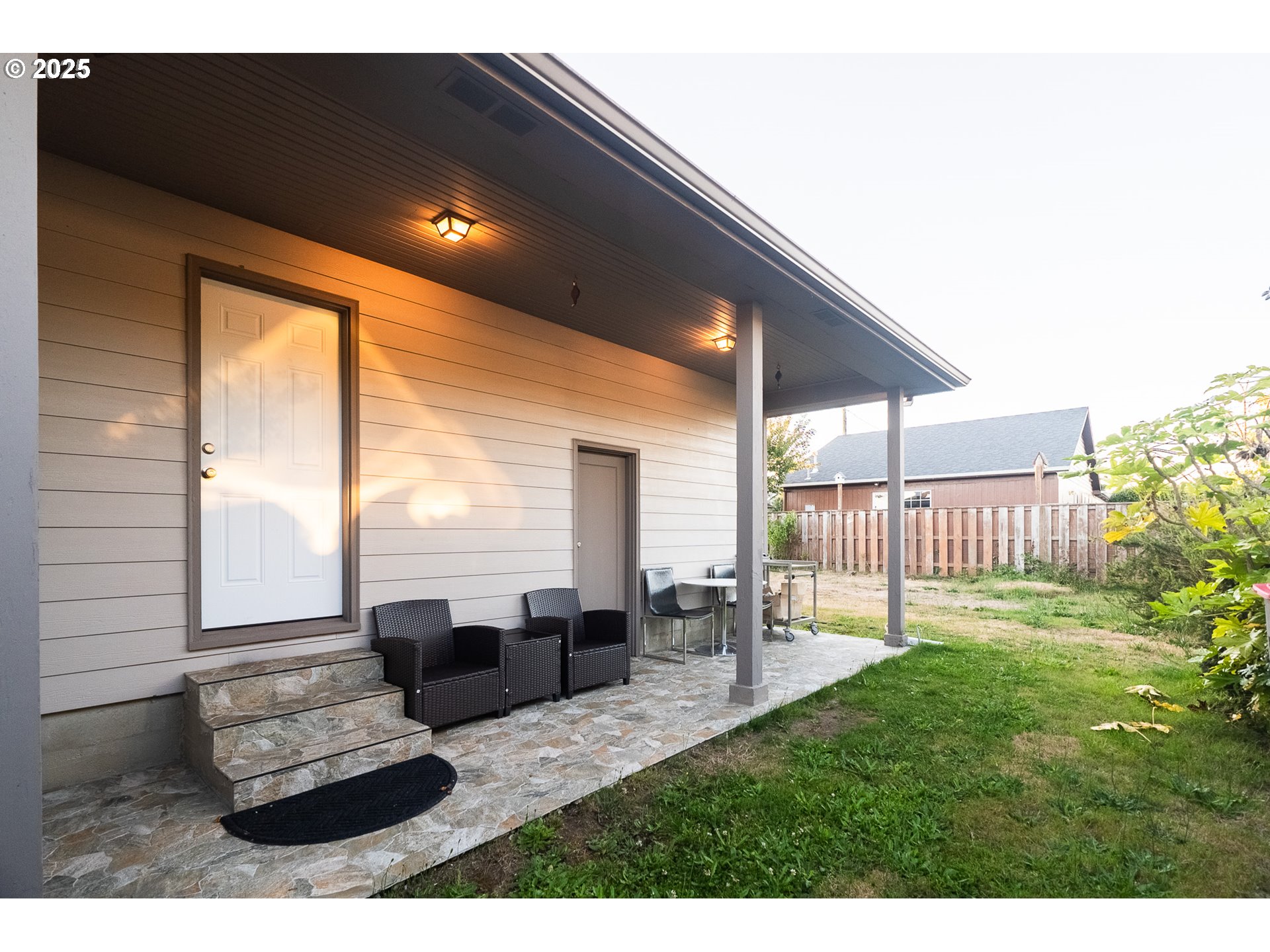 815 North King Street Seaside, OR 97138 - Photo 28 of 33 a living room with furniture and a floor to ceiling window