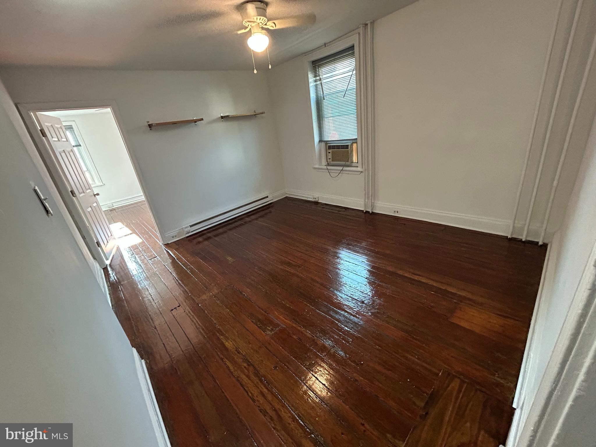 3700 Midvale Avenue, Unit 2 Philadelphia, PA 19129 - Photo 5 of 13 an empty room with wooden floor and windows